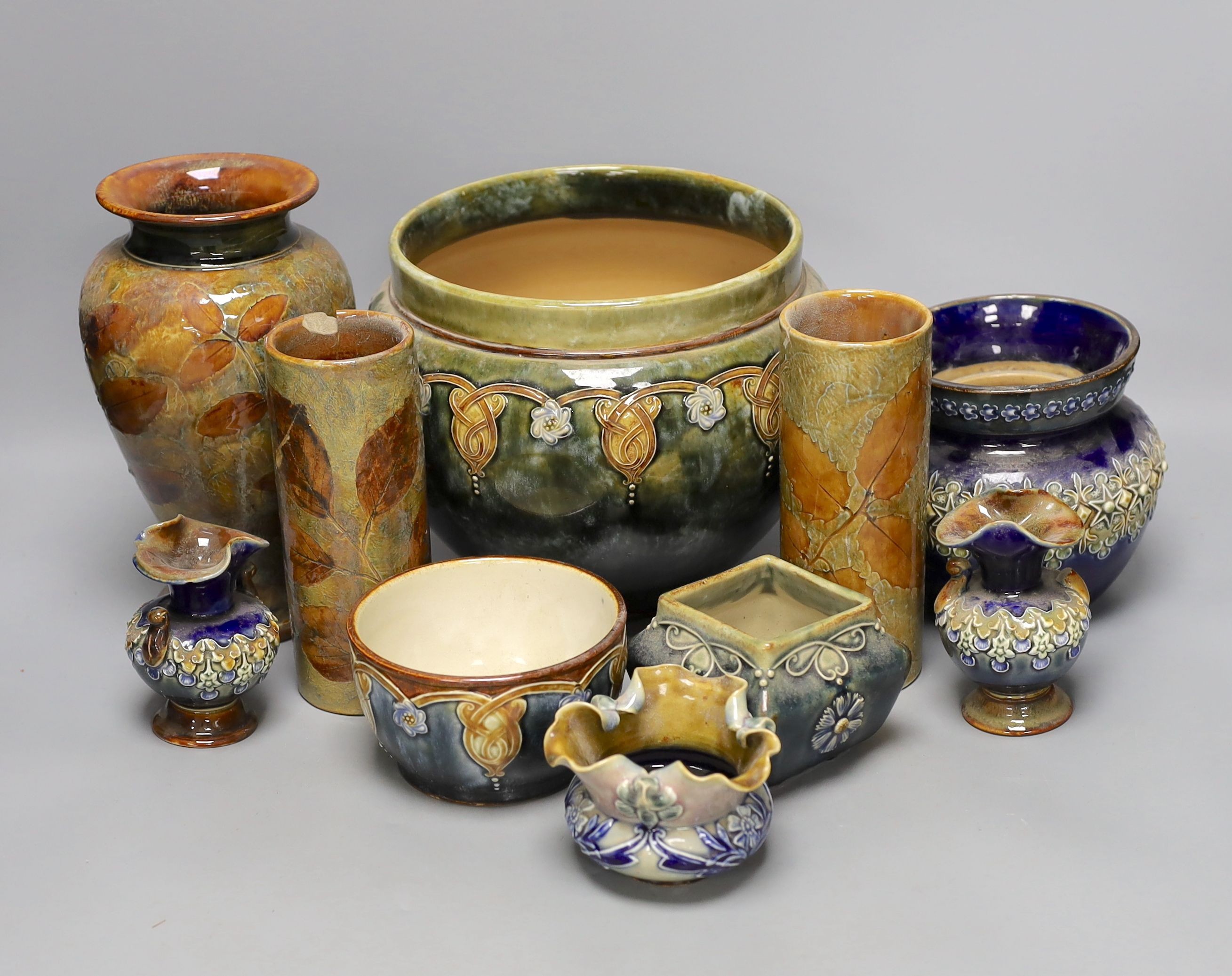 10 pieces of Doulton Lambeth stoneware including a jardiniere, vases etc, largest item jardiniere, 19 cms diameter.